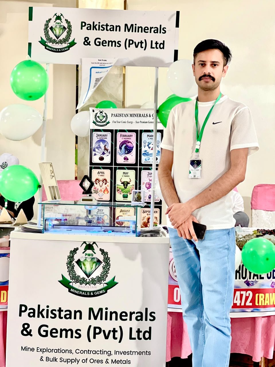 Pakistan Minerals & Gems exhibition stand with green and white balloons in Rawalpindi